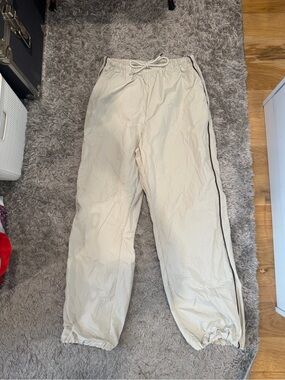 cream parachute pants (with pockets and adjustable ankle)